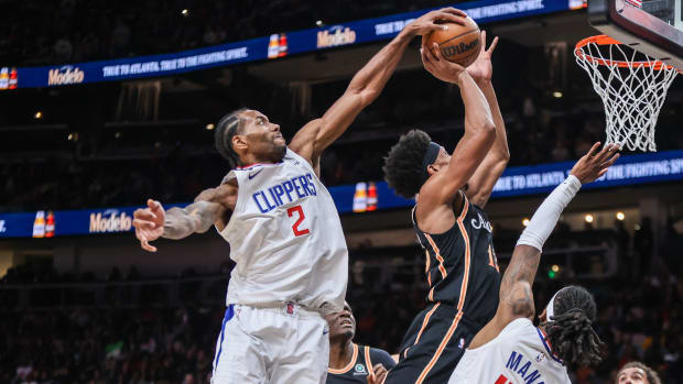 Clippers forward Kawhi Leonard blocks the shot of Hawks forward De'Andre Hunter.